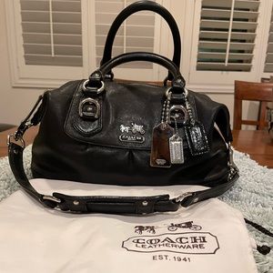 2004/2005 black Coach purse with purple lining. Silver trim.